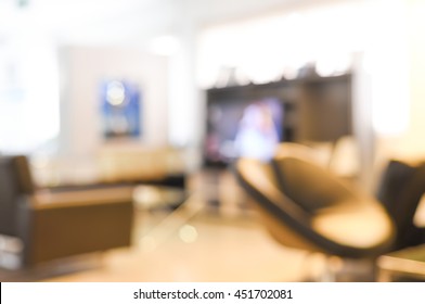 Blur Customer Waiting Room Lounge Desk And Chairs And Television At Repairs Shop - Blurred Background