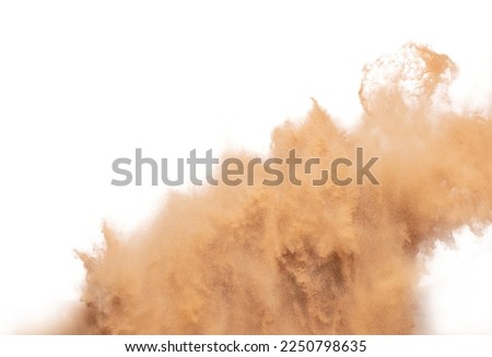 Blur Defocus image of Small Fine Sand flying explosion, Golden grain wave explode blow. Abstract sands cloud. Yellow colored sand splash up in Air. White background Isolated high speed shutter freeze