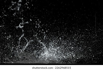 Blur Defocus Image of Water hit wall ground, explode into drop droplet. Amount Water attack impact and fluttering in air explosion. Stop motion freeze shot. Splash Water for texture elements