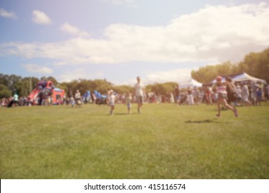 Blur Defocused Background Of People, Family In Park Fair, Fun Festive Summer Festival 