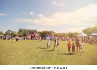 Blur defocused background of people in park fair, summer festival, family outdoors, festive fair - Shutterstock ID 348952283