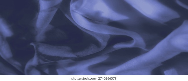 In a blur, draping layers of deep blue material form mesmerizing contours, casting gentle highlights and subdued depths that conjure a serene, whispering aura of refined grace.