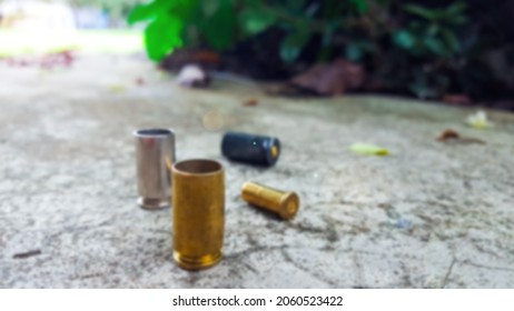 Blur Empty Pistol Bullet Shells On Concrete Ground In A Shooting Range