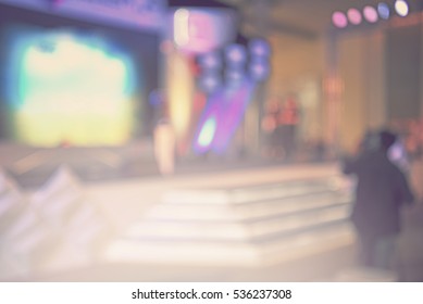 Blur Event With People Background - Activity On Stage And Camera Man -  Blurred Computer Game Show Festival  Bokeh Light Vintage Tone - Business Concept