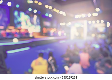 Blur Event With People Background -  Blurred Computer Game Show Festival  Bokeh Light Vintage Tone - Business Concept