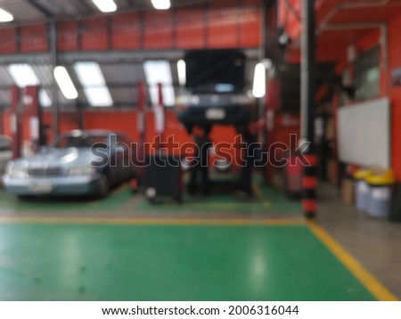 Blur focus of Car raised on car lift in autoservice.