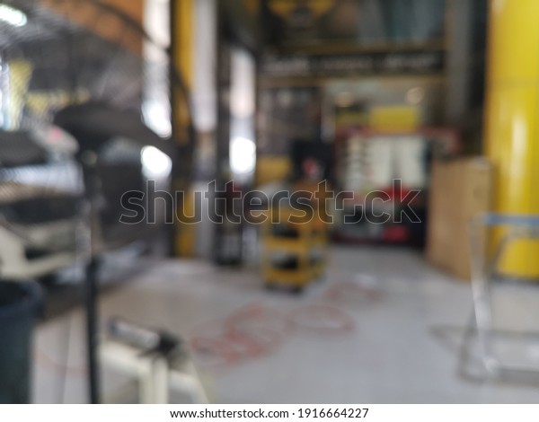 Blur focus of Car in a car repair station.Car\
service center.