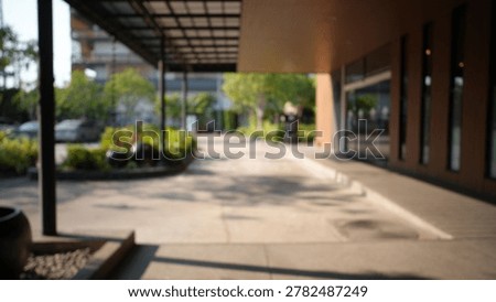 Blur focus of empty long corridor in the modern office building.