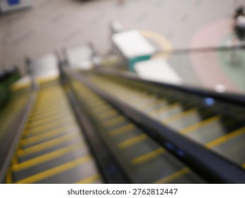Blur focus of escalator elevator stairs lift in shoping mall.