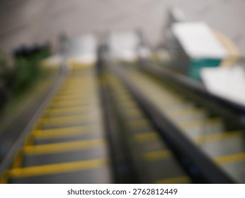 Blur focus of escalator elevator stairs lift in shoping mall.