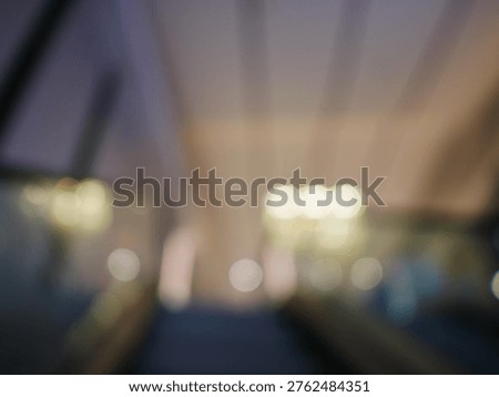 Blur focus of escalator elevator stairs lift in shoping mall.