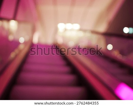 Blur focus of escalator elevator stairs lift in shoping mall.