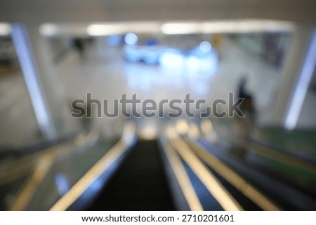 Blur focus of Escalators in Interior of shoping mall.