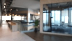 Blur Focus Of Fashion And Modern Office Interiors. Front View Of A Loft Open Space Office Interior. Blur Background.