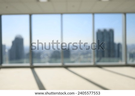 Blur focus of glass wall from building in city town background.