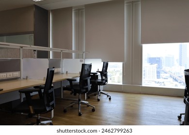 Blur focus of Interior of modern empty office building.Blur Empty chair and desk in modern office.