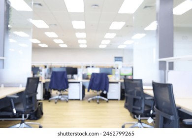 Blur focus of Interior of modern empty office building.Blur Empty chair and desk in modern office.