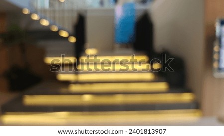 Blur focus of a lighting feature  stairs . Led lighting is concealed under steps of stairs.