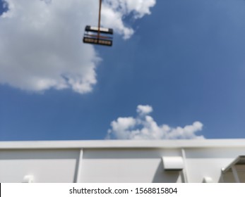 Blur Focus Of Modern Distribution Center From Outside,Warehouse With Blue Sky