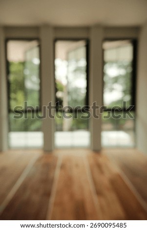 Blur focus of Modern empty interior with wooden floor and white walls.