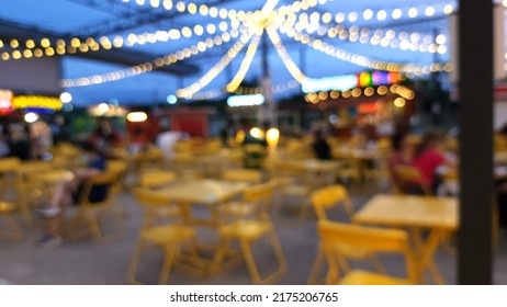 Blur Focus Of Night Street Food Market Festival In A Park. Market Stalls. Outdoor Market. Food Event. Food Fair.