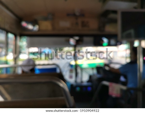Blur focus of\
people on the bus in Thailand.Blur focus of Passengers on a bus\
traveling around Bangkok in\
Thailand.