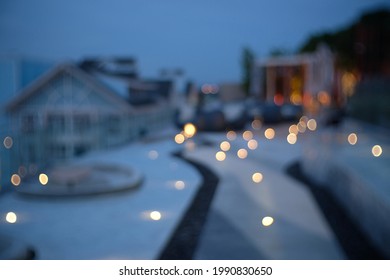 Blur Focus Of Sky Lounge Infinity Pool On Rooftop With Beautiful Seascape Night View.