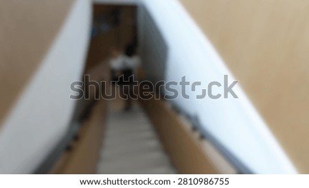 Blur focus of stairs going down in a building.