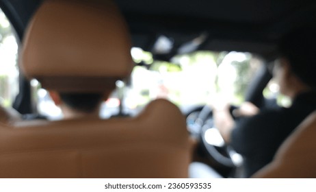 Blur focus of view form Back passenger seats in modern luxury car.