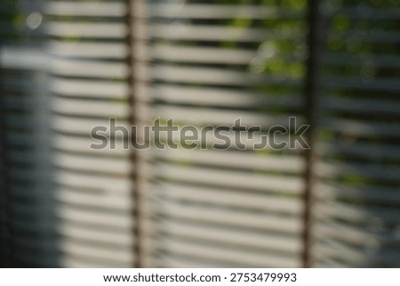 Blur focus of Windows roller blinds home interior design element window detail wooden window blind shutter with daylight from window daytime home interior design concept