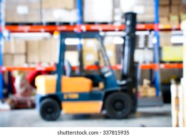 Blur Of Folk Lift Truck In Factory