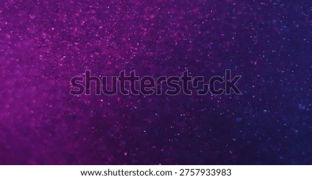 Blur glitter texture. Gradient background. Neon purple blue color glow water bright dazzle acrylic flow on art illuminated bokeh light abstraction.