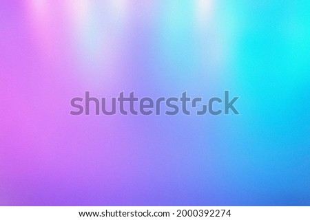 blur, grain, and texture of iridescent holographic abstract bright neon colors background. blurred colorful multicolored backdrop from glowing lights
