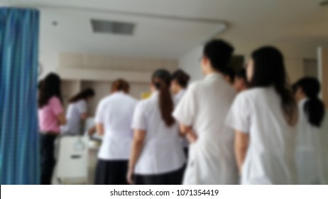 Blur Of Group Of Medical Externship Or Extern Are Experiential Learning Opportunities In Hospital With Real Inpatient And Otolaryngologist At Ward In Hospital. Practicing Medical Student Concept.