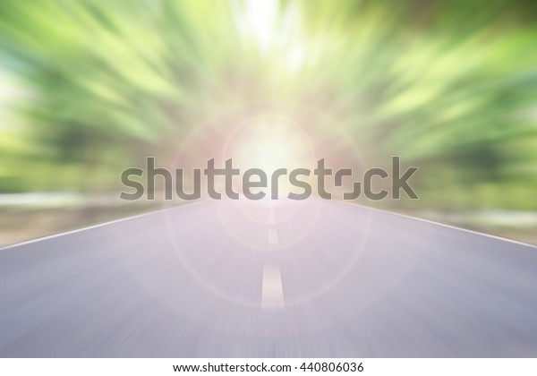 blur high speed road with cloudy sky and sunlight\
background at evening