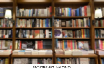 Blur Image Of Bookshelf And Retro Lamp. Empty Bookstore Or College Or Library Concept Photo.