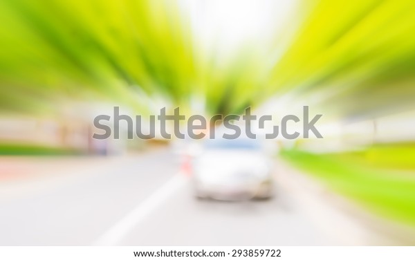 blur image of car\
and tree in background .