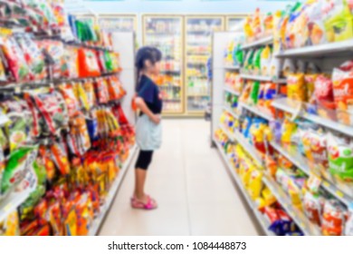 Blur Image Of Children Are Buying Snacks In A Convenience Store.