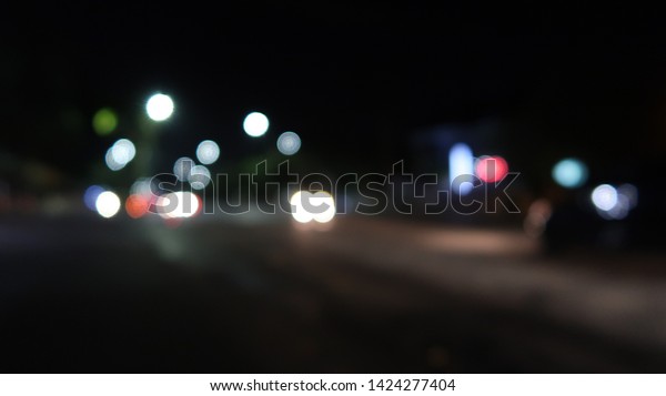 blur image of city at\
night.blurred urban abstract traffic background. blur, bokeh,\
street, traffic , car