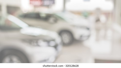 Blur Image Of Commercially Cars Stand In Show Room Of Car Shop.