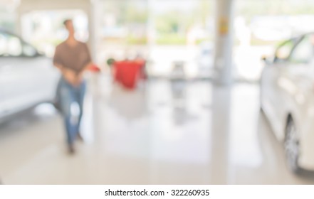 Blur Image Of Commercially Cars Stand In Show Room Of Car Shop For Background Usage.