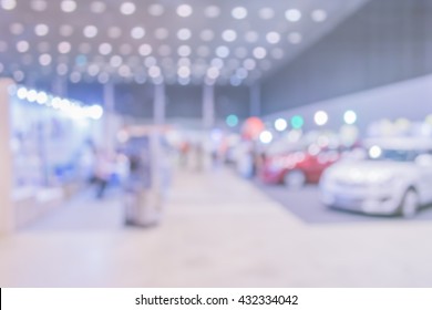 Blur Image Of Commercially Cars Stand In Show Room Of Car Shop For Background Usage.