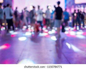 Blur Image Of Crowded People In Chinajoy Exhibition. Young People Have Fun On Musical Show Time. Entertainment Event Background.