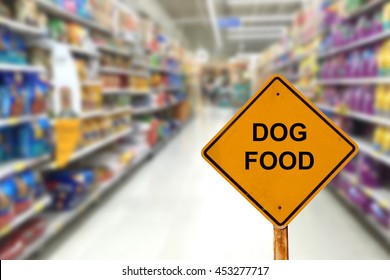 Blur Image Of Dog Food Aisle In Supermarket With Message