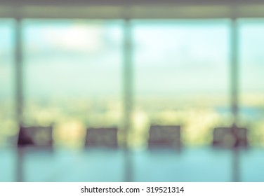 Blur Image Of Empty Boardroom With Window Cityscape Background. Business Concept