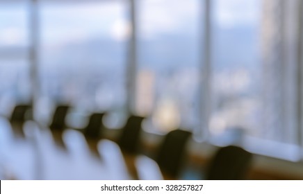 Blur Image Of Empty Boardroom With Window Cityscape Background. Business Concept