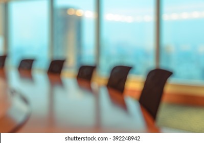 Blur Image Of Empty Boardroom With Window Cityscape Background. Business Concept