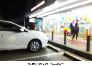 Blur Image Of The In Front Of The Convenience Store At Night.