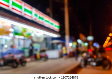 Blur Image Of The Front Of The Convenience Store At Night.