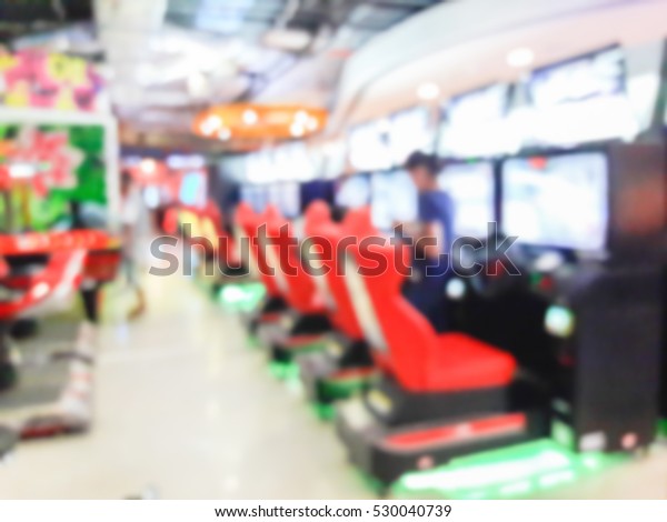 Blur\
image of game zone in the mall , use for\
background.